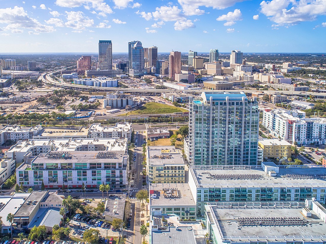 COURTESY PHOTO â€” The recent $90 million sale of the 23-story Skyhouse Channelside apartments (below right) show investors are still drawn to Tampa.