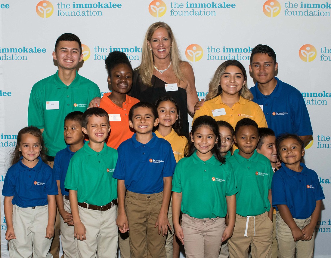 Joyce Hagen, Immokalee Foundation board of directors chair, with students at the Charity Classic where golfers and sponsors raised $2.5 million for the foundation&#39;s new career program. Courtesy Immokalee Foundation