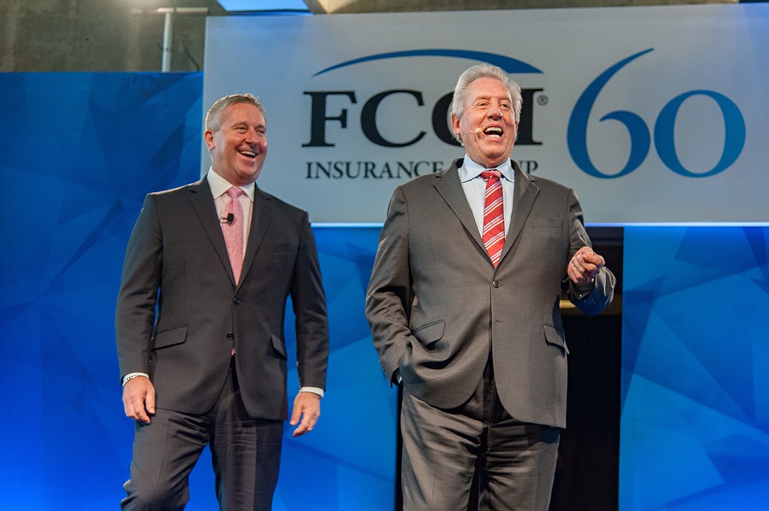Courtesy. FCCI President and CEO Craig Johnson, left, with leadership expert John Maxwell.