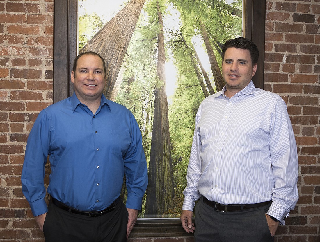 Mark Wemple. MyArea Network executives Scott Conlon, left, and David Annis.