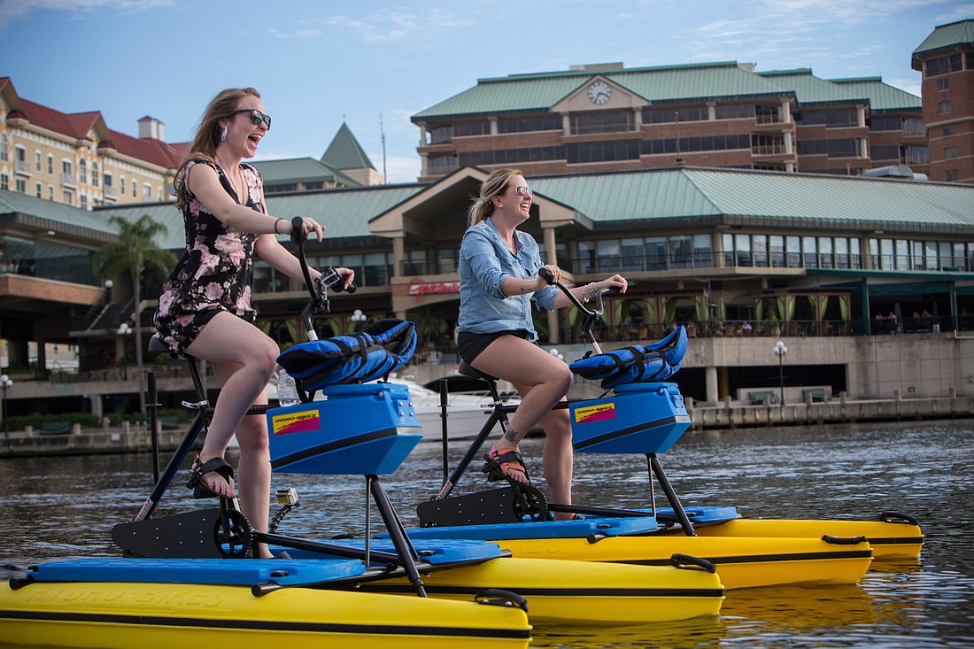 Tourists enjoy Tampa Bay Waterbikes on the Hillsborough River in downtown Tampa. Photo courtesy of Visit Tampa Bay / brianadamsphoto.com.