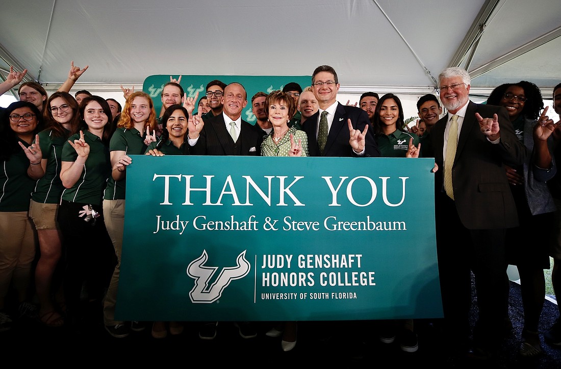 University of South Florida President Judy Genshaft, center, in green dress, and her husband, Steven Greenbaum, donated $20 million to the university. Courtesy photo.