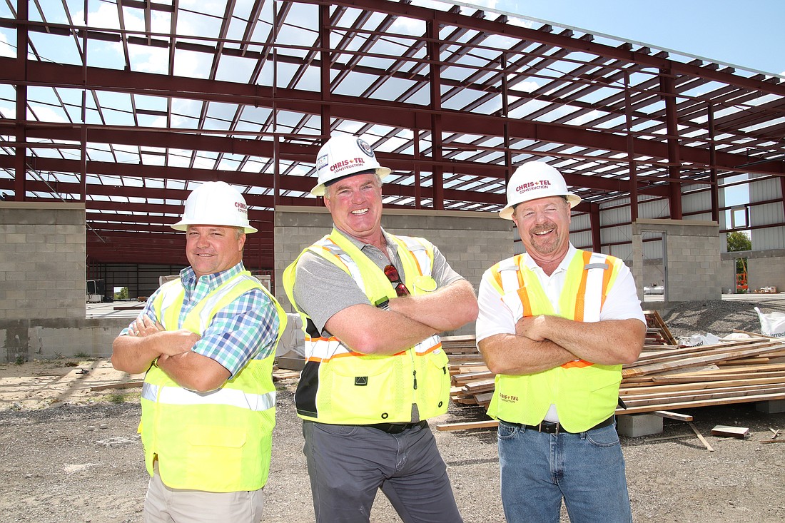 From left, Chris-Tel President Howard Wheeler, Project Manager Eric Schneider and Project Superintendent George Pisello on the job site at the expansion of Eastern Metal Supply in Fort Myers. JimJett.com photo
