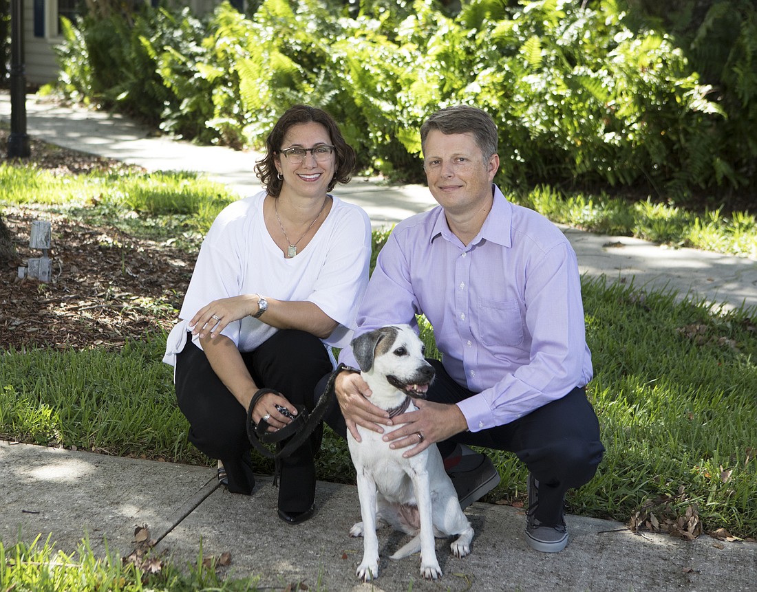 Mark Wemple. Essentials PetCare COO Christine Battista, left, and co-founder Doug Spiker with Annie, their rescue dog that inspired them to start the company.