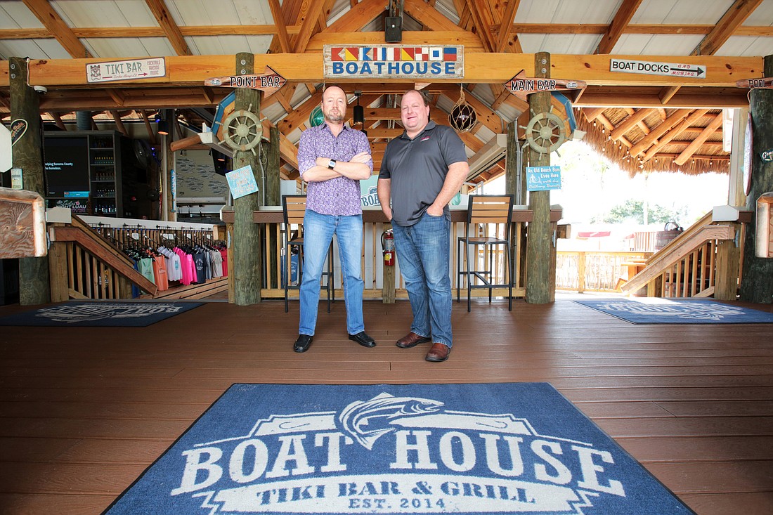 Nils Richter and Robert Fowler Jr. stand inside the Boathouse Tiki Bar & Grill in Fort Myers. Photo by Stefania Pifferi.
