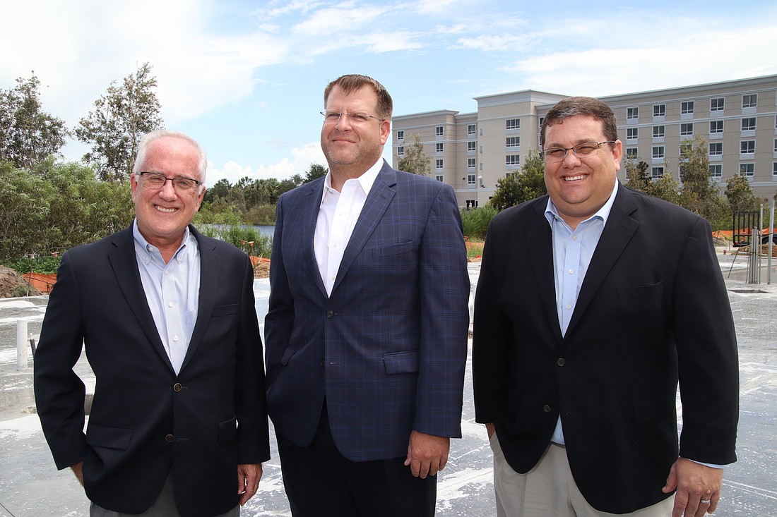 JIM JETT â€” William Price Jr., James Nulf and Matt Price, the principals behind Seagate Development Group, at the future site of the company&#39;s headquarters in Fort Myers.