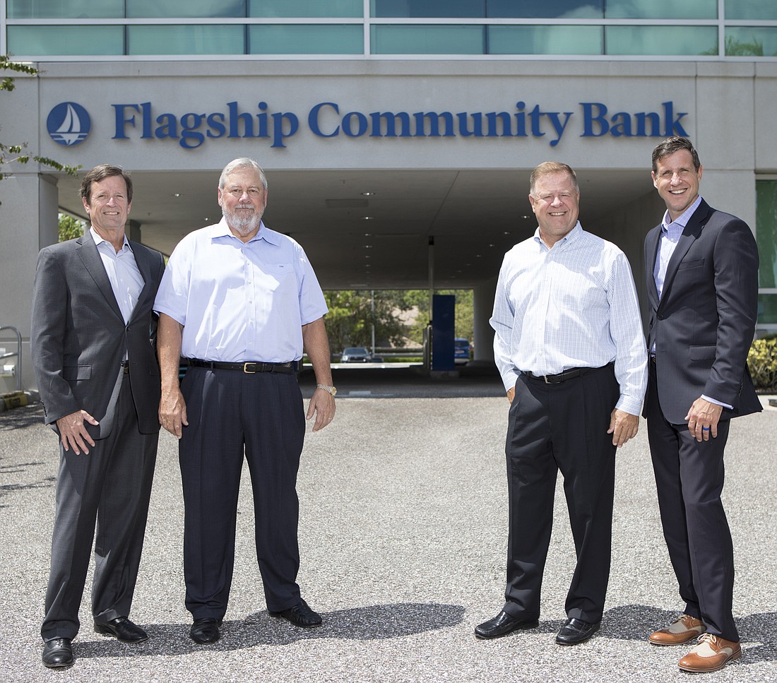 Mark Wemple. Bob McGivney, second from left, leads a team hoping to grow Flagship Community Bank. Also pictured, from left, is President and COO Jim Nelson, Chairman Paul Wikle and  Executive Vice President Rob Shaw