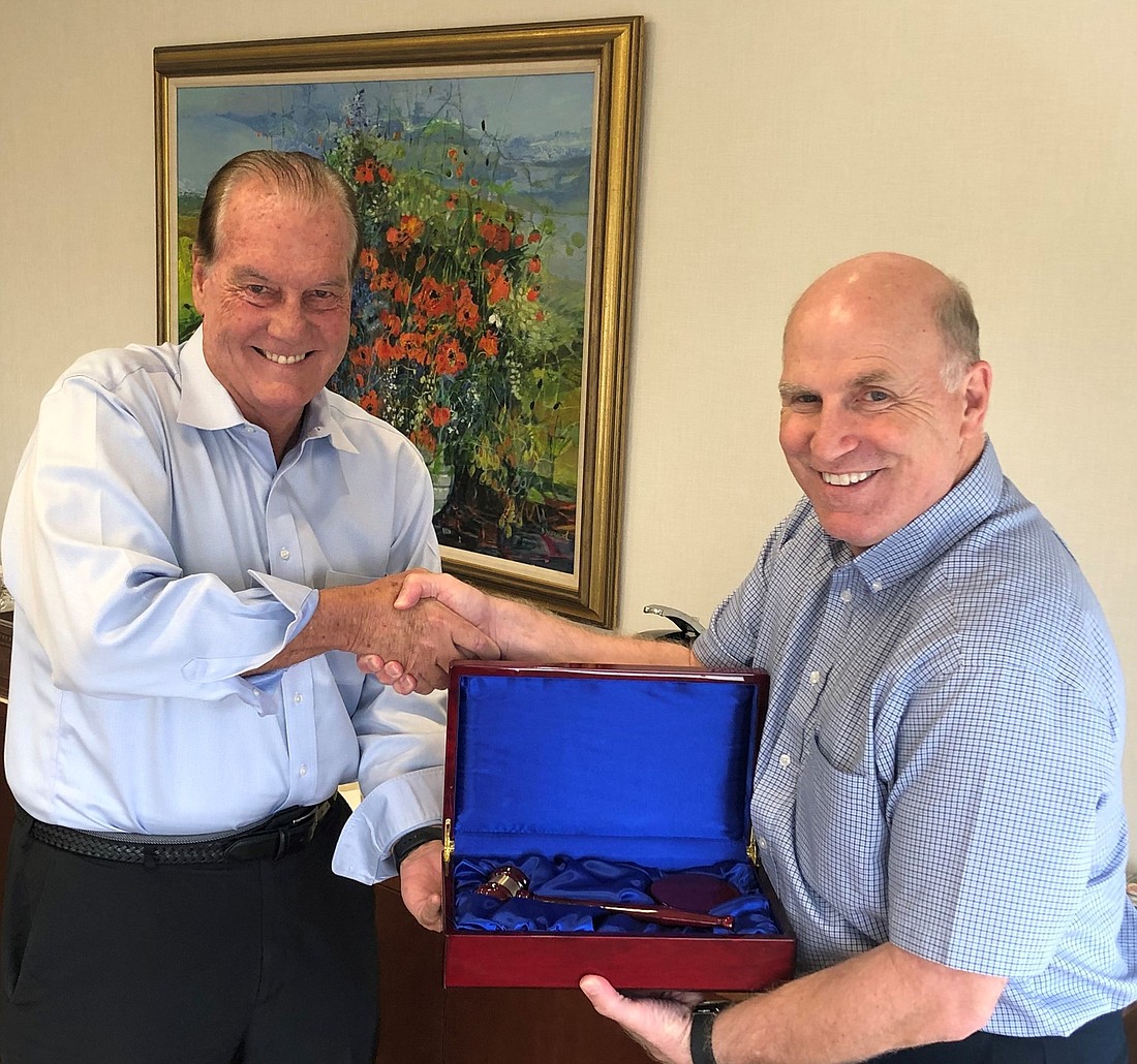 Courtesy. Mike Martella, the Van Wezel Foundationâ€™s immediate past board chair and current vice-chairman, passes the gavel to the foundationâ€™s newly elected chair, Jim Travers.