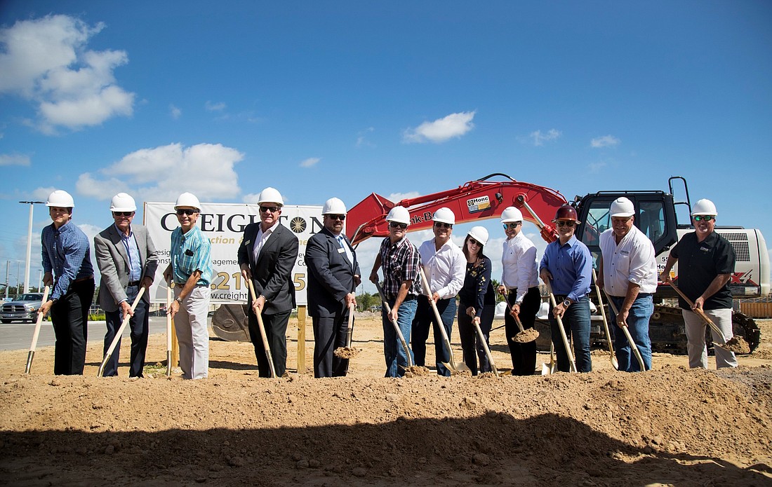 Officials with Lucky&#39;s Market and  Creighton Construction & Development were joined by others to break ground for the grocery chain&#39;s first store in Lee County. Contributed photo.