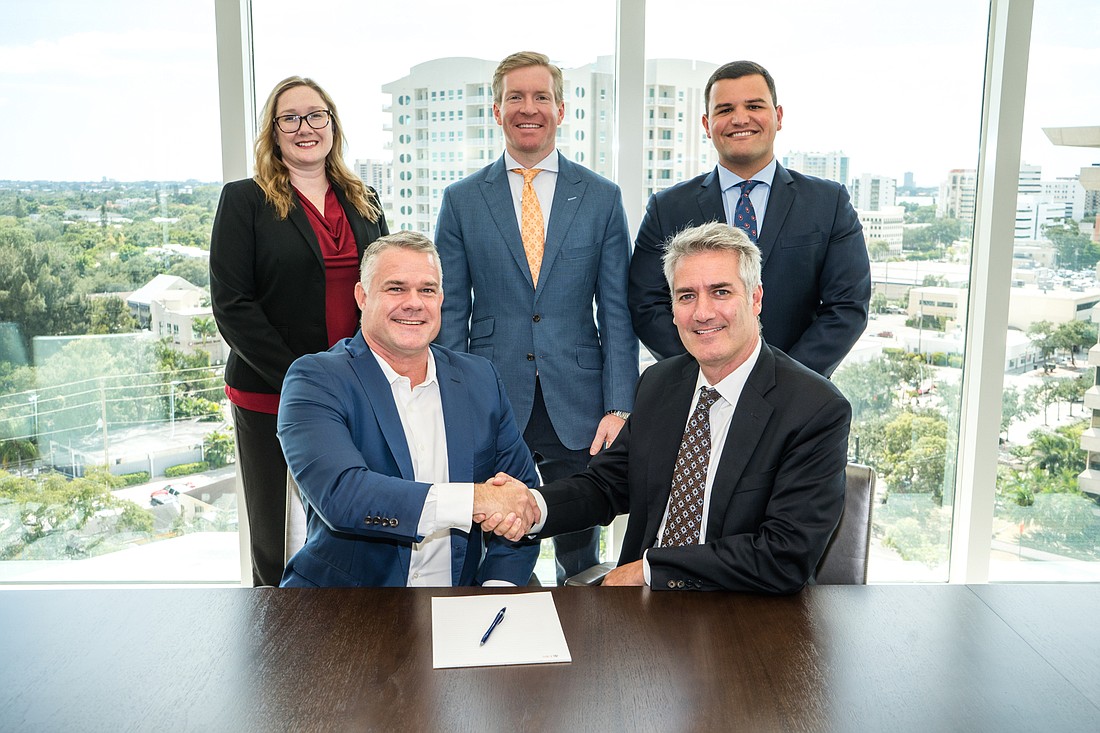 Courtesy. Jason Hughes and ScottÂ Zelniker of UBS Financial Services have joined forces to form The Zelniker Dorfman Heritage Group.
