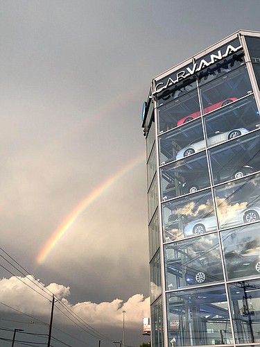 FIle. Carvana behind its glass tower vending machines, is growing rapidly nationwide.