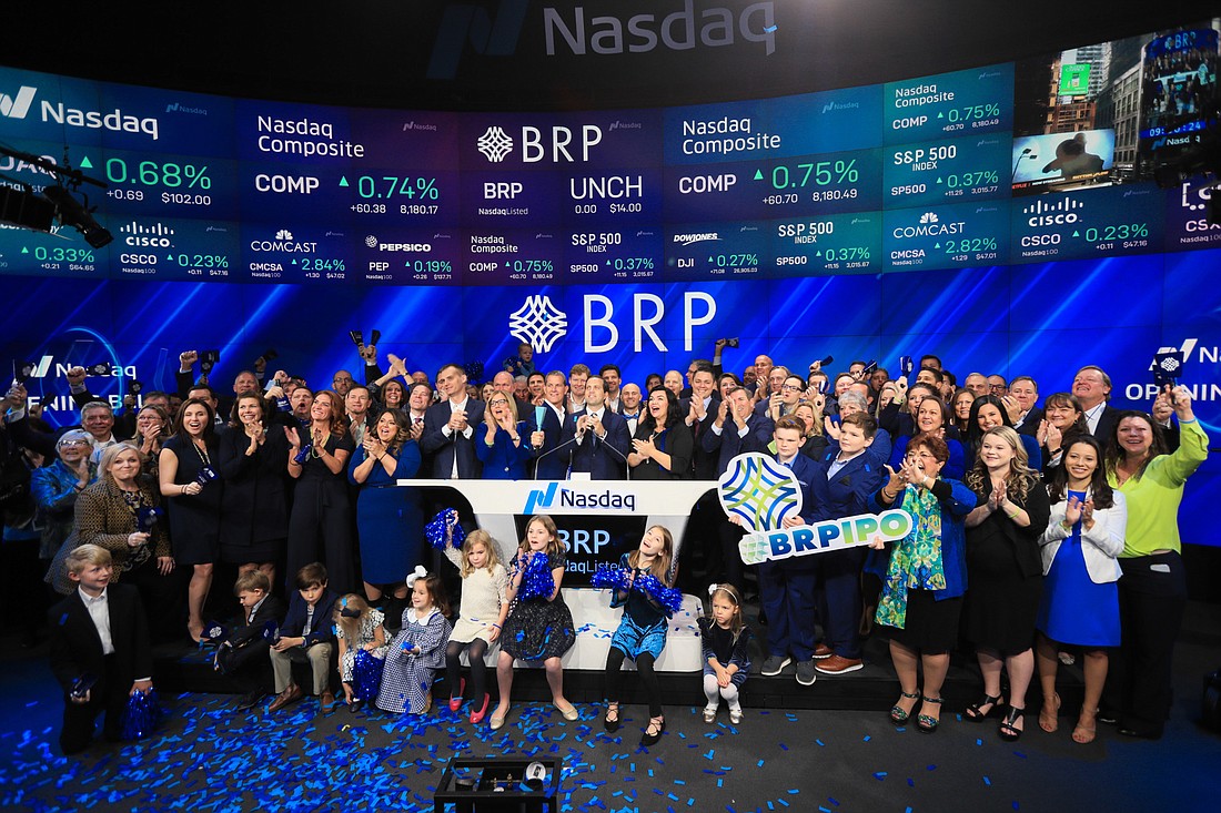 Courtesy. Some 100 employees of Tampa-based BRP Group traveled to New York City on Oct. 24 to ring the ceremonial opening bell when the company went public.