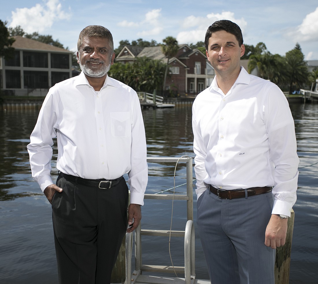 Mark Wemple. TypTap CEO Paresh Patel and President Kevin Mitchell seek to change the way people think about flood insurance.
