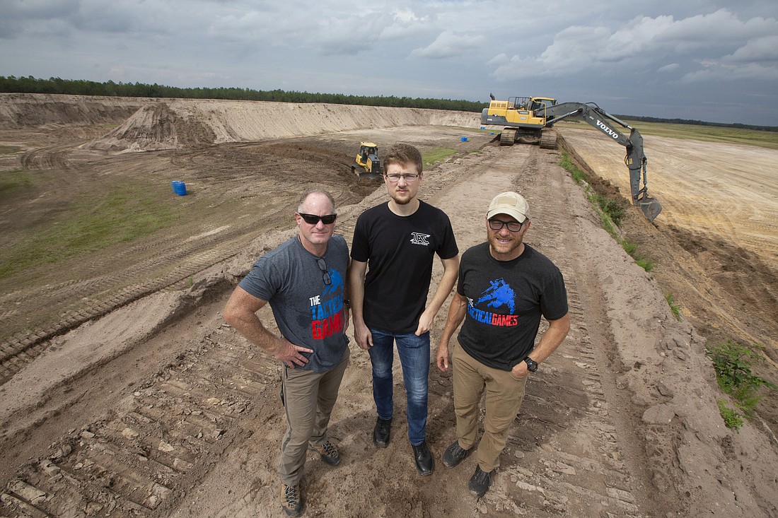 From left: Tim Burke, Joel Jaeb and Steve Jaeb atop a berm separating several of five shooting ranges near Nichols in south Polk County, part of JTAC Ranch.