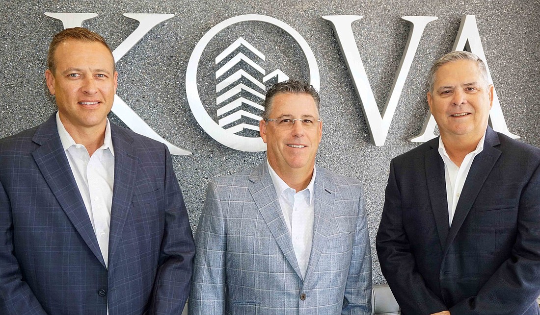 Courtesy. Michael Jonas, left, and Lee Norris, far right, are in KOVA Cos. appraisal unit. Kova CEO and managing partner Anthony Emma, middle, oversees the unit through two acquisitions.