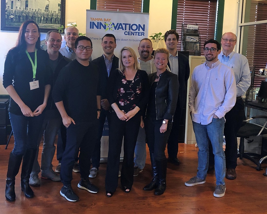 Tonya Elmore, center, with members of the Tampa Bay Innovation Center&#39;s 2019 business accelerator cohort. Courtesy photo.