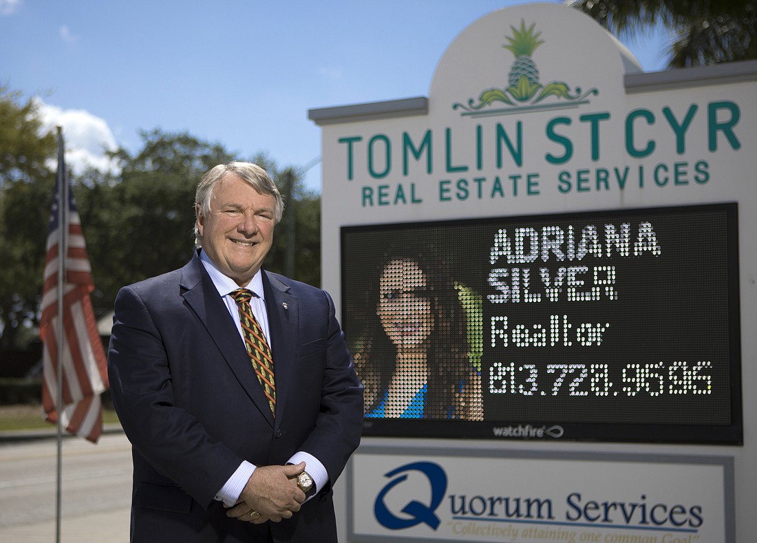 Mark Wemple. John Tomlin founded Tomlin St. Cyr Real Estate Services in 2016, along with his wife, Holly, and daughter Allison.