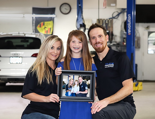 Courtesy. Auto repair shop Elite Motor Works is providing free oil changes and free safety evaluations for health care workers during the coronavirus crisis. Owner Jamie Caldwell with his wife, Heather, and daughter Skylar.