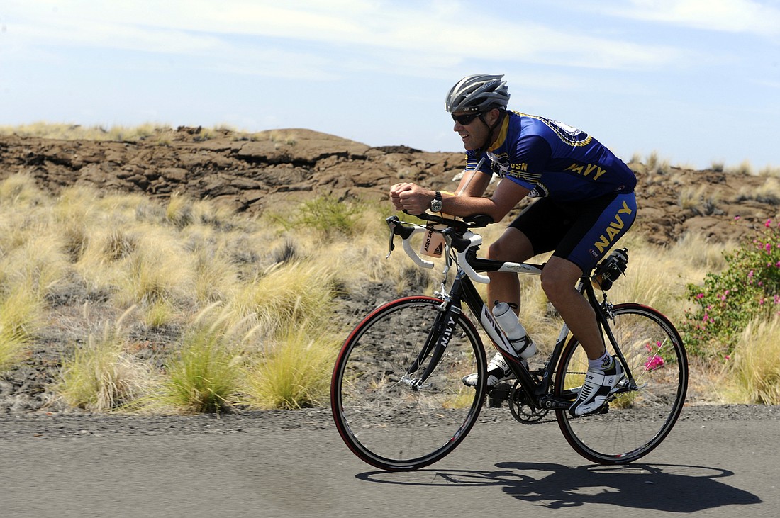 A competitor trains for the 2009 Ford Ironman World Championship triathlon in Kailua-Kona, Hawaii. Photo courtesy of U.S. Navy / Wikimedia Commons.