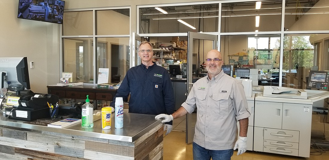 Courtesy. Performance Copying & Printing Co-owners Steve Levison and Dan Levison are hoping to ease cost burdens for businesses by offering a deep discount on the printing of materials related to the coronavirus.