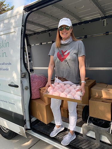 Courtesy. Deanna Wallin, Founder and CEO of Naples Soap Co., donates bath bombs and essential items like shampoo, deodorant and soap to healthcare workers and local children for Easter.