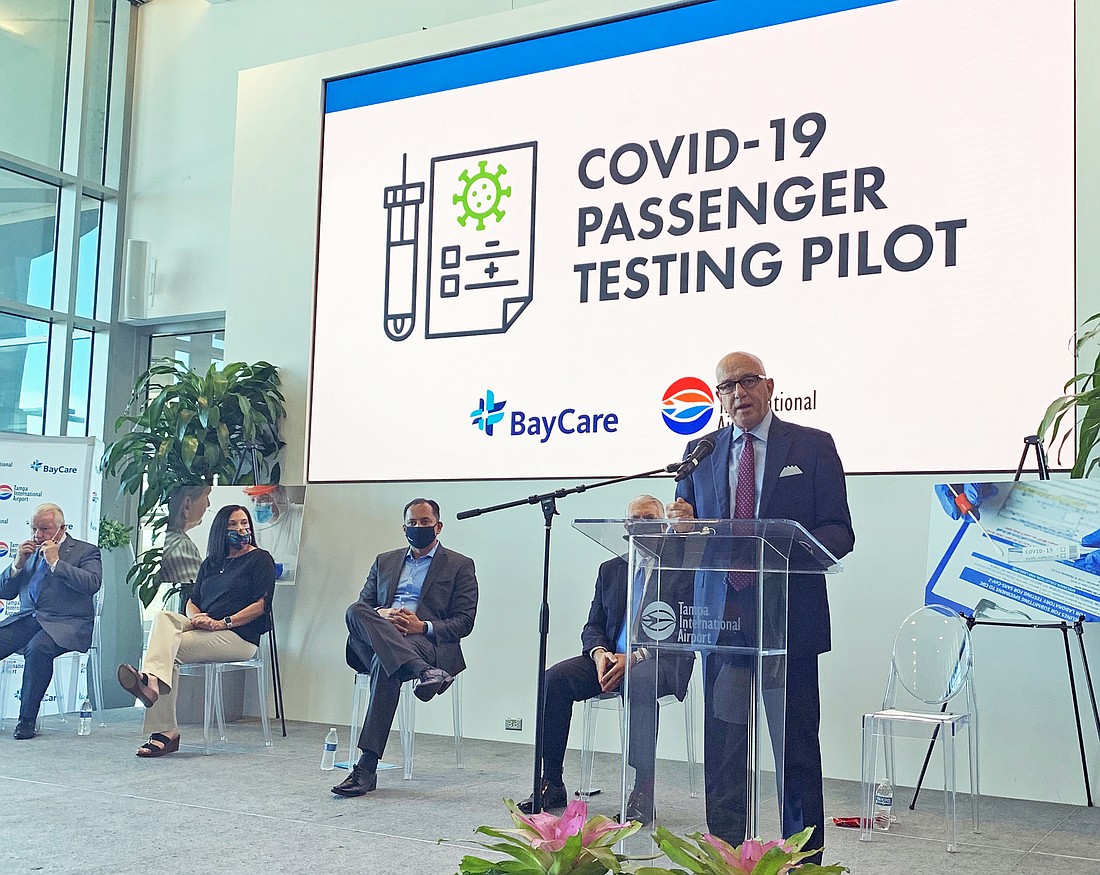 Courtesy. Tampa International Airport CEO Joe Lopano, at podium, announces the airport&#39;s new COVID-19 testing program.