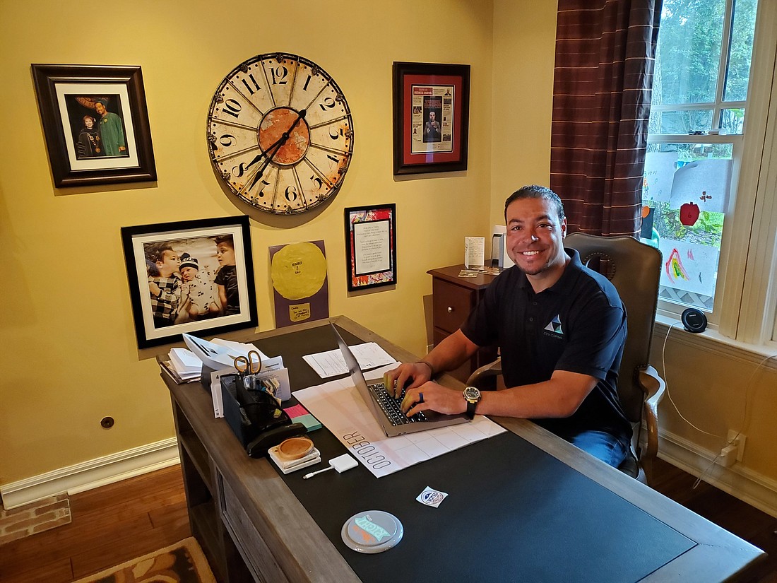Courtesy. Former Tampa Bay Buccaneer Vincent Jackson, now the CEO of CTV Capital, works in his home office in South Tampa.