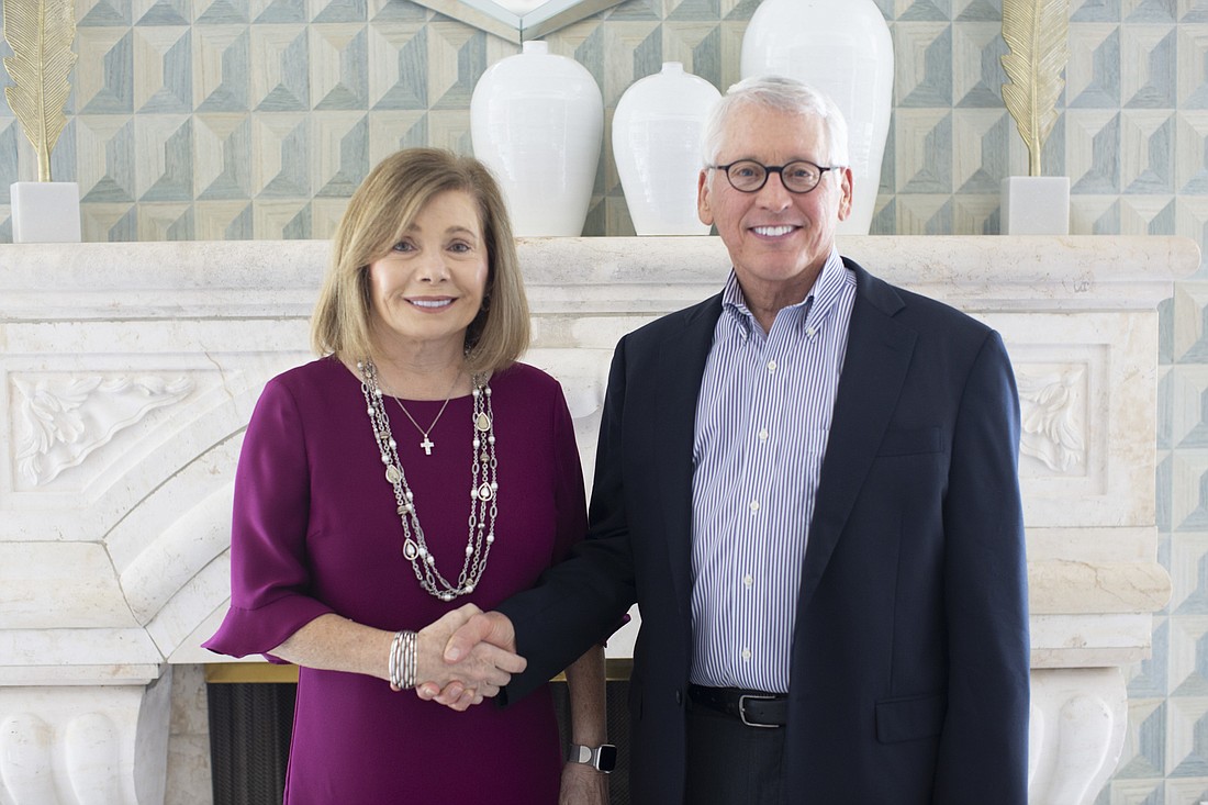 Courtesy. Phillip Wood and Maria Procacci, principals of John R. Wood Properties and Vineyards Naples Properties, respectively, announced a merger of their firms together in the statement.
