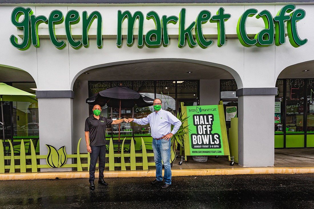Courtesy. Green Market Cafe owner Andrew Koumi, left, has teamed up with Little Greek Franchise Development President Nick Vojnovic on a franchising initiative.