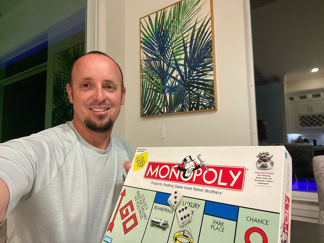 Courtesy. Rob Stalvey enjoys Monopoly.