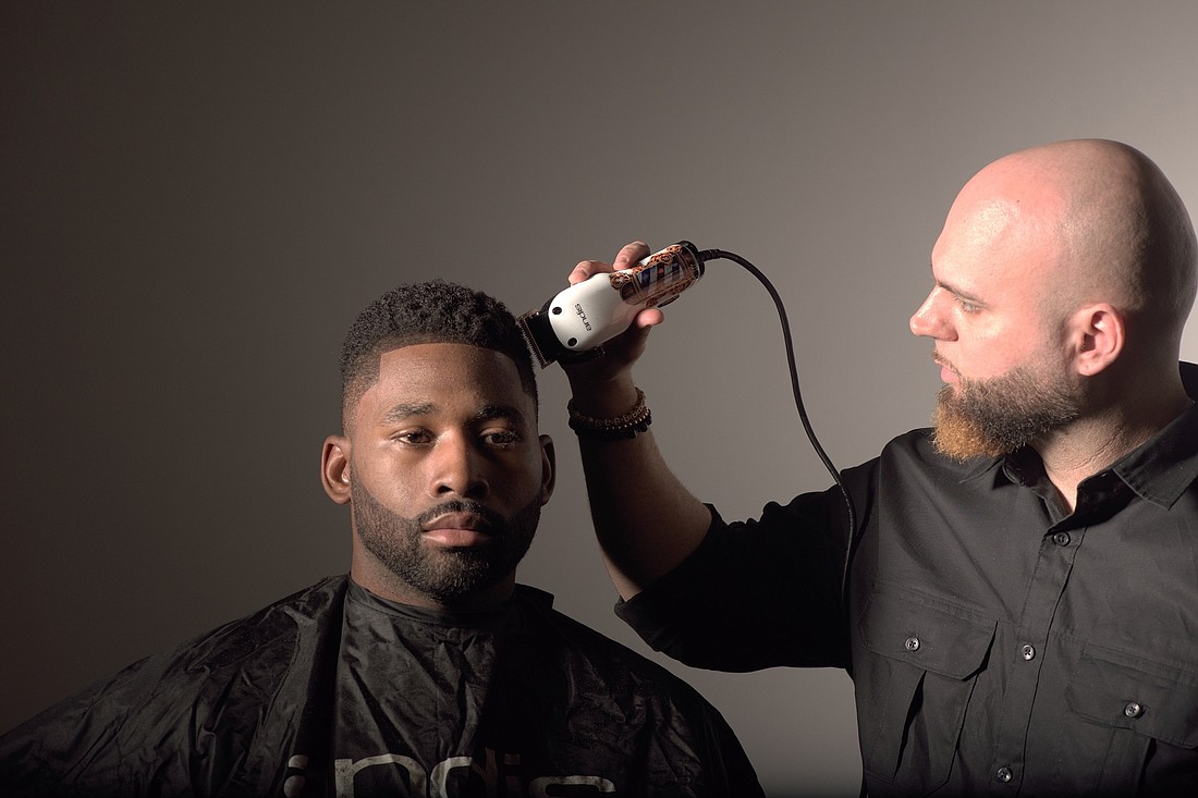Courtesy. Sean Casey works on the hair of a client at TwinCutZ, Jackie Bradley Jr., an outfielder with the Boston Red Sox.