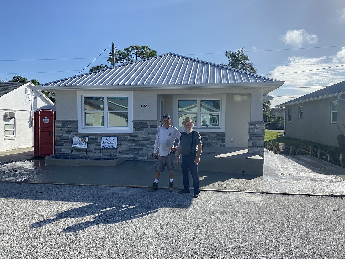 Courtesy. Albert Miller, right, with Sand Dollar Homes & Construction, focuses on new construction home projects in Sarasotaâ€™s Pinecraft neighborhood with the help of Pete Wagler, left, from Wagler Construction.
