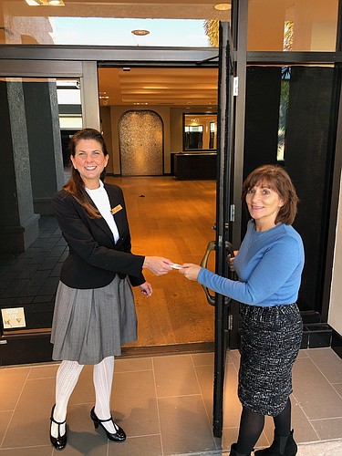 Courtesy. Julie Clark, right, Bell Towerâ€™s Marketing Manager, presents Amy Ginsburg with the keys to the Southwest Florida Symphonyâ€™s new Artistic and Operations Center.Â