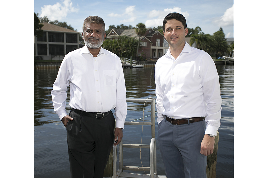 File. TypTap CEO Paresh Patel, left, and President Kevin Mitchell.