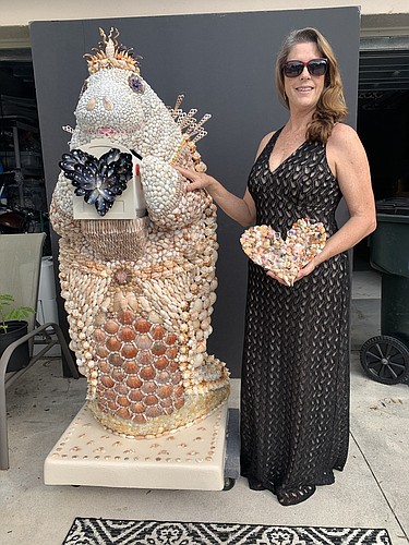 Courtesy. Ginny Dickinson recently created Her Royal Majesty â€“ Manatee Mer, a seashell sculpture. This is her third sculpture, and like the other two, will be auctioned for charity.
