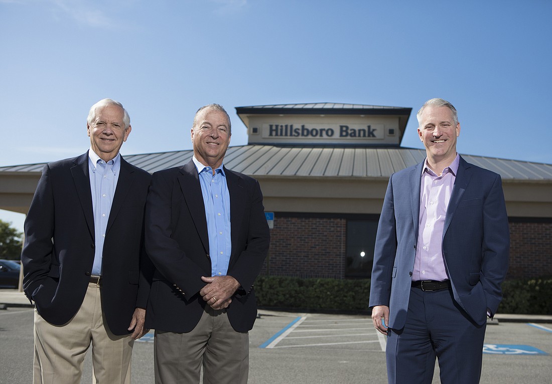 Mark Wemple. The Bank of Tampa&#39;s Bill West, left, and Corey Neil, far right, are looking forward to the merger with Hillsboro Bank, overseen by Mike Ward, middle.