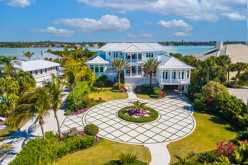 The home is situated on a section of Casey Key with views of both the Gulf of Mexico and Blackburn Bay.
