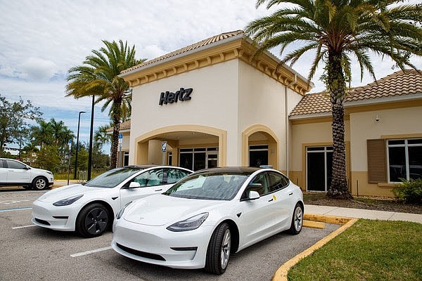 COURTESY: Hertz to offer up to 50,000 Teslas to Uber drivers.