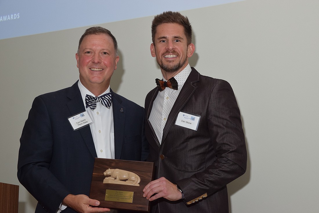 Courtesy. Dan Stone, right, receives his Penn State alumni award from Tom Neely, general manager of the Nittany Lion Inn in State College, Pa.