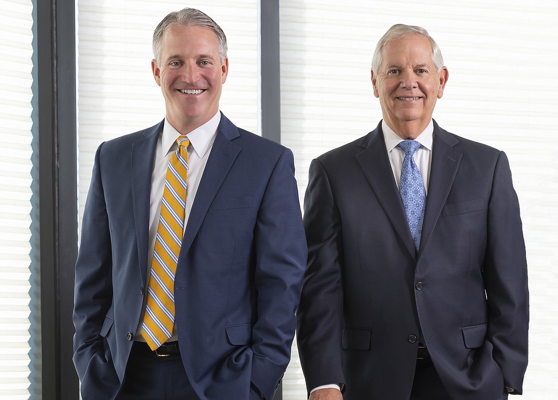 COURTESY: T. Corey Neil, L, has been named CEO of The Bank of Tampa. Bill West will remain CEO of the bank&#39;s holding company, Tampa Bay Banking Company.