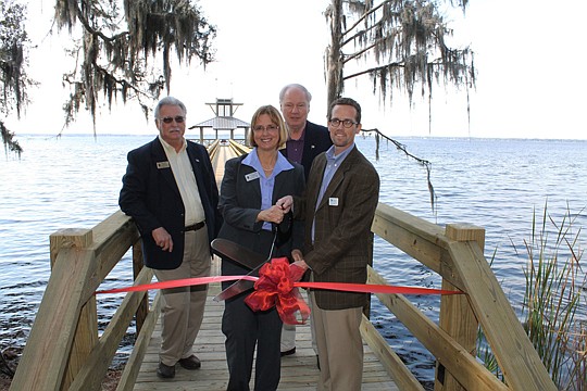 County Commissioners Ron Sanchez, Cyndi Stevenson and Jay Morris with RiverTown's Chris Kuhn.