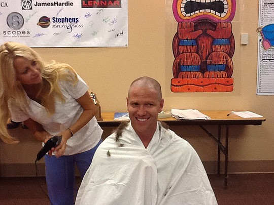 NEFBA executive Daniel Davis made a pledge prior to the membership drive: bring in 150 new members and he'll have his head shaved. That's what happened, and wife Rebekah was one of those who did the clipping and shaving.
