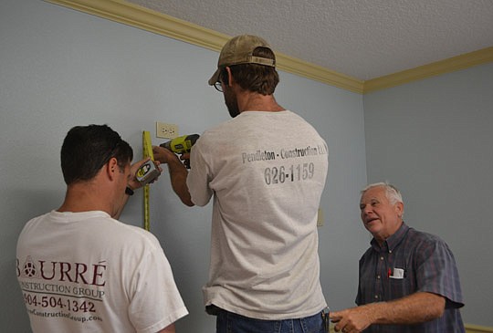 Michael BourrÃ©, Steve Pendleton and Bill Wilson on the job.