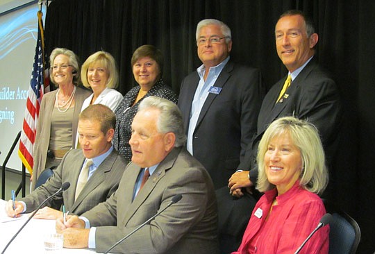 The Accord was signed by (seated, from left) NEFBA's Daniel Davis and NEFAR's Glenn East. Also on the dias were (seated, right) NEFBA President Barbara Moore, and (standing) taskforce members Linda Moore, Rose Bock, Millie Kanyar and Dan Braithwaite. ...