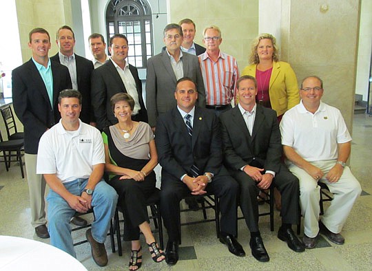 Rep. Frank Artiles (seated, center) was welcomed at a luncheon last month by a group of builders and lobbyists that included (seated, from left) Michael Bourre, Denise Wallace, Artiles, Daniel Davis and Rick Morales, and (standing, from left) Chet Ski...
