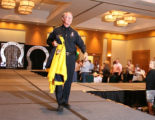 Duval County Sheriff John Rutherford was among the runway models at last year's WCR Fashion Show, tradeshow and silent auction at the Sawgrass Marriott. About 200 members of the Jacksonville Women's Council of Realtors kicked up their heels with the "...