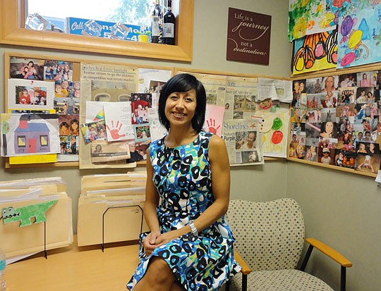Moon in her office surrounded by family photos.