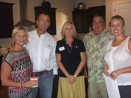 Dennis Homes held a Realtor event last month to show off a model in RiverTown. Jennie and Trace Barlow, and Wendy Dennis, of Dennis Homes were there and welcomed David Provost of the St. Joe Company and Christy McCarthy of Interiors Revitalized.