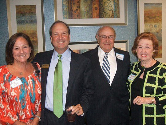 Gil Pomar (second from left) is the bank's area president and he's here with family: sister Cindy Selock and parents Gil and Nancy.