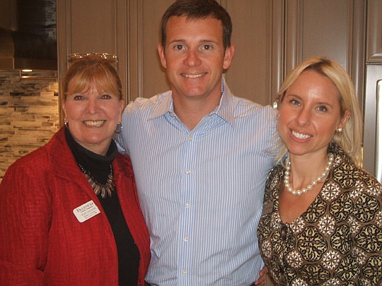 Arthur Rutenberg Homes held an opening of a new model at Palencia last month and the host group included (from left) Pud English of Palencia and Adam Merrill and Jenny Krebs of Arthur Rutenberg Homes.